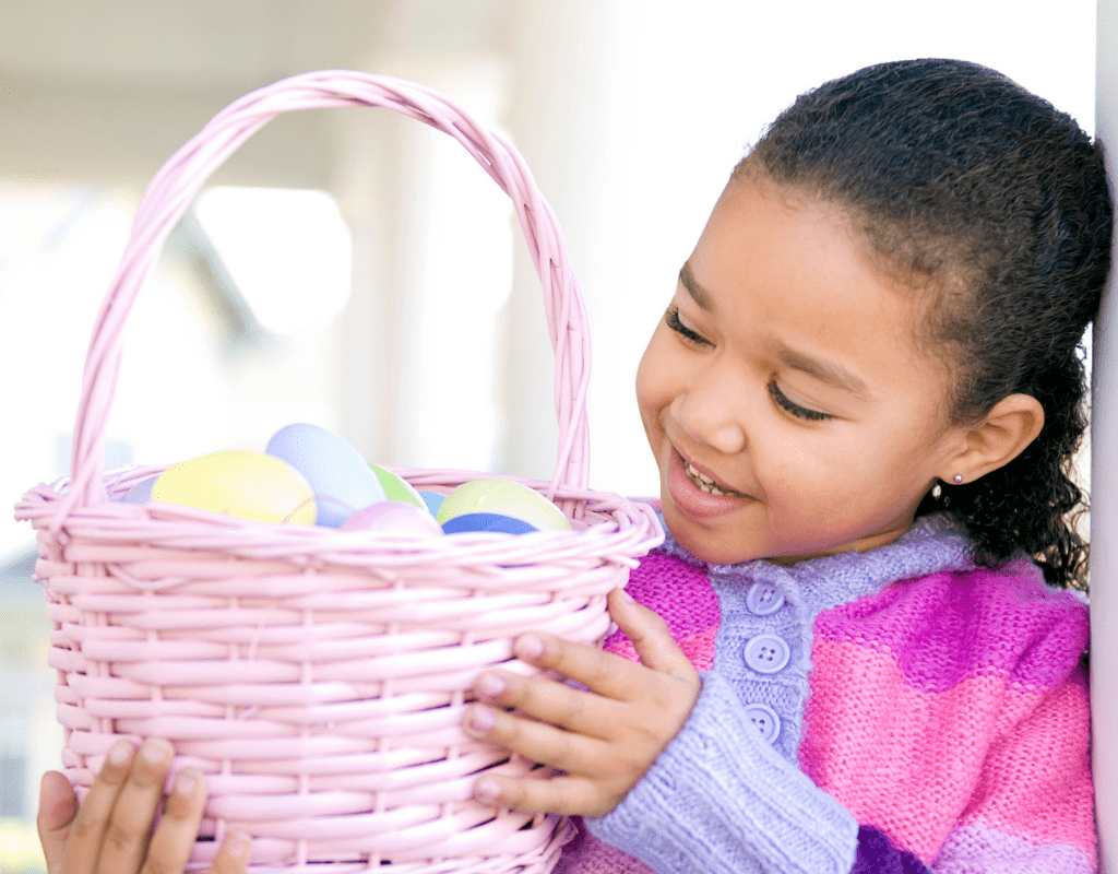 A young girl holding an easter basket