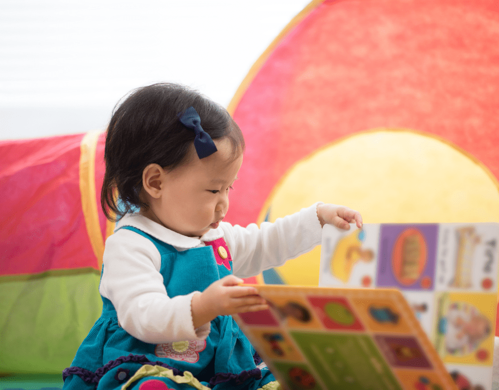 bilingual baby reading a board book