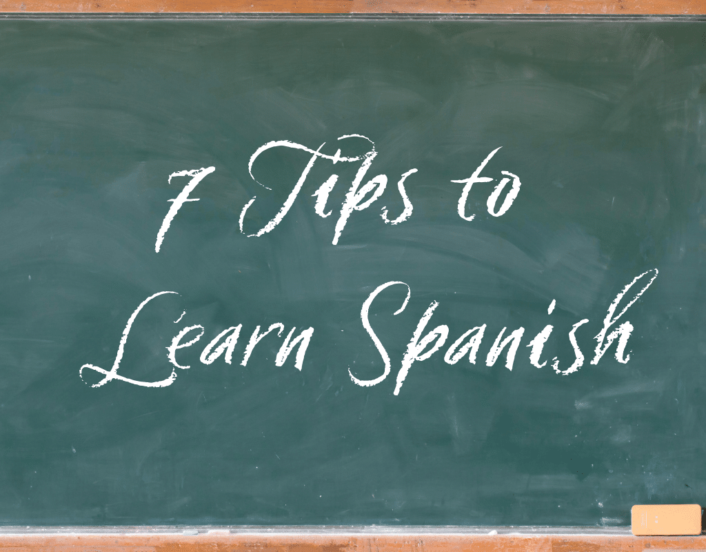 green chalk board with the words 7 tips to Learn Spanish on it