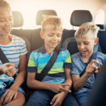 kids playing travel game on road trip