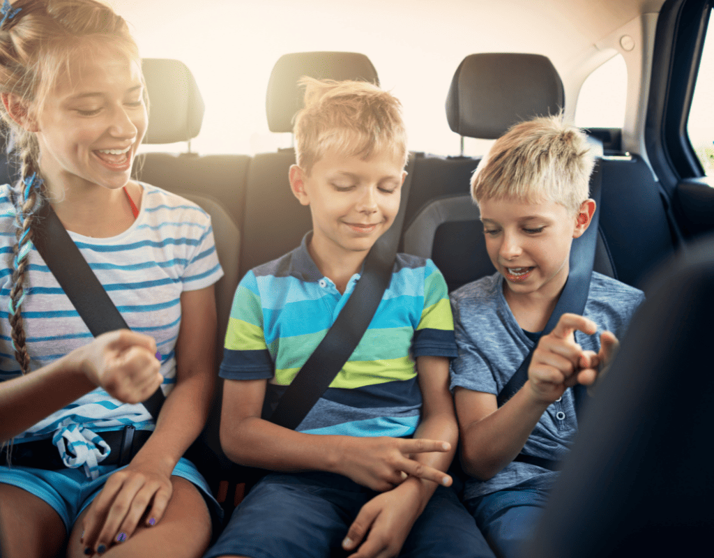 kids playing travel game on road trip