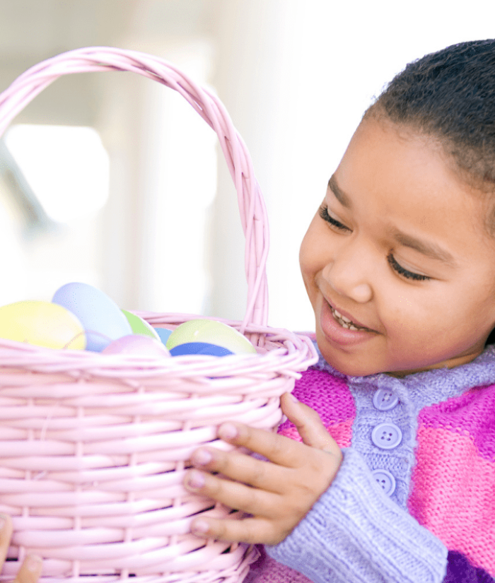 A young girl holding an easter basket
